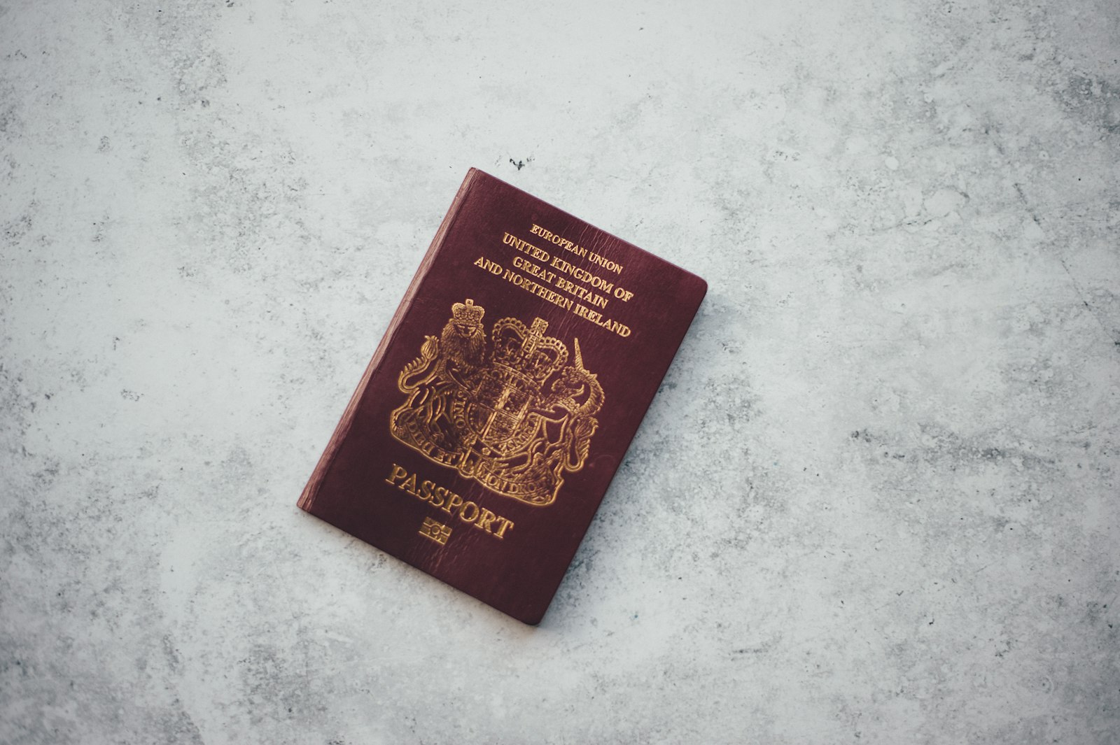 UK passport on a table, representing the UK eVisa system now used for Pakistani visit visa applicants